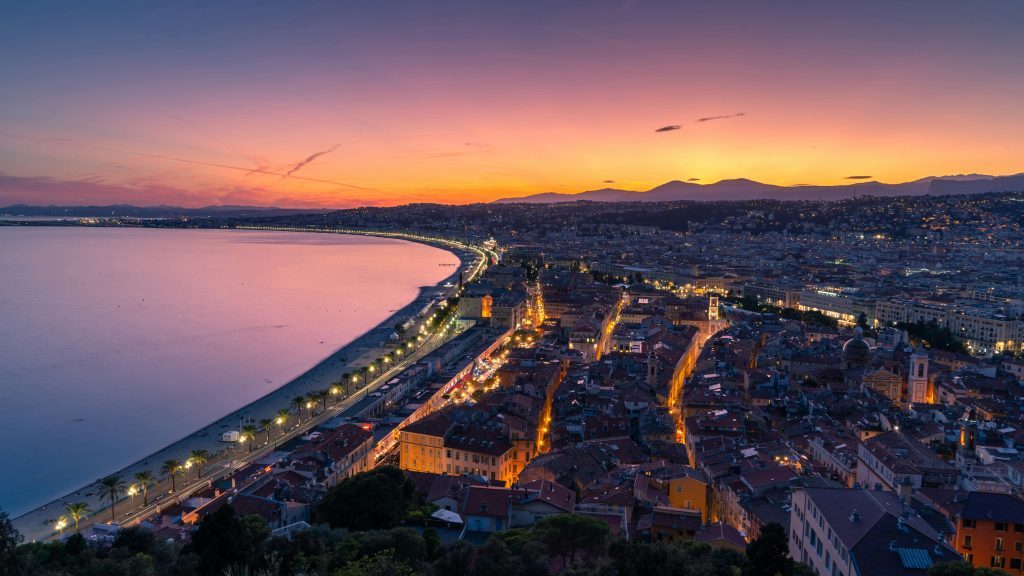 Cityscape and Body of Water during Sunset